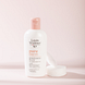 Louis Widmer Purederm Reinigingsmelk Zonder Parfum 200ML Lichtroze achtergrond met product