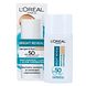 L'Oréal Paris Bright Reveal SPF50 Tinted Glow Fluid 50ML Verpakking met flesje ernaast L'Oréal Paris Bright Reveal SPF50 Tinted Glow Fluid 50ML Verpakking met flesje ernaast