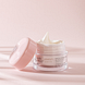 Louis Widmer Nutriderm Nachtcrème Nutritive Licht Geparfumeerd 50ML  Lichtroze achtergrond met pot en deksel schuin tegen potje aan