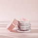 Louis Widmer Nutriderm Dagcrème Éclat Rosé UV 50 Licht Geparfumeerd 50ML  Lichtroze achtergrond met product