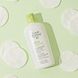 Louis Widmer Skinappeal Zuiverende Lotion Zonder Parfum 150ML licht groene achtergrond met wattenschijfjes en product Louis Widmer Skinappeal Zuiverende Lotion Zonder Parfum 150ML licht groene achtergrond met wattenschijfjes en product
